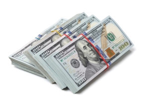Stack of One Hundred Dollar Bills on white background fundraising