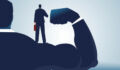 Illustration of a strong business person standing behind a person in a suit.