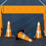 ERISA litigation, digital infrastructure top of mind after 401(k) executive order Under construction traffic cones and orange barrier road boundary.