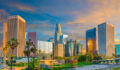 Dusk light with dramatic clouds in downtown Los Angeles and freeway, California.