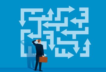 Illustration of businessperson confused about which way to go.
