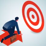 Photo of a person on an arrow that is moving toward a target.